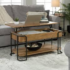 Pemberly row wood lift top coffee table in washington cherry with hidden compartment, living room furniture finished on all sides for versatile placement anywhere in your home. Station House Lift Top Coffee Table Etched Oak 426434 Sauder Sauder Woodworking