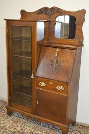 Secretary desks—much like telephone benches—are a pretty cool piece of furniture, and they've evolved quite a bit over time. Larkin Antique 1900 S Drop Front Tiger Oak Secretary Desk Side By Side Bookcase Antique Secretary Desks Antique Oak Furniture Antique Furniture