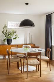 Love The Light Fixture And Mixed Materials Of Wood Chairs W Marble Table White Round Dining Table Dining Room Inspiration Round Dining Table