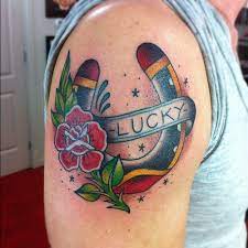 See more ideas about horse shoe tattoo, flash tattoo, tattoos. Traditional Flower And Lucky Horseshoe Tattoo On Shoulder