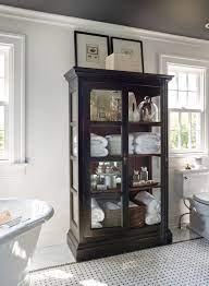 The curio came from bed bath and beyond about 8 years ago. Cabinets Help Tell The Story Of Our Home And Lives Here Are Tips For Filling These Statement Pieces W Bathroom Storage Cabinet Large Bathrooms Bathroom Design