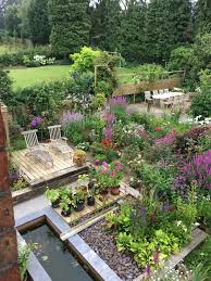 Purple Planting Next To Deck Carp Pond To Filter Water Cottage Garden Design Garden Layout Small Vegetable Gardens