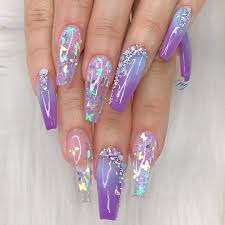 Acrylic nails are artificial nails. Kefilwe Mabote Amal Fashanu Sinitta Malone Attend Lux Afrique Polo Day 2019 Wearing Latest African Fashion Clothing Purple Acrylic Nails Lavender Nails Long Acrylic Nails Coffin