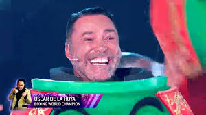 Boxing champ Oscar De La Hoya was plucked from the competition last night  when it was revealed that he was Fuzzy Peas. Did you guess right? Watch The  Masked Singer every Wednesday