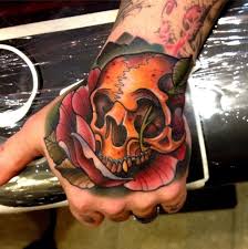 Bright red hearts and roses will spruce up the love of any couple. Colorful Skull Tattoos