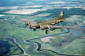A Fully Restored World War Ii B 17 Aircraft Nicknamed Shoo Shoo Shoo Baby Flies Over Open Countryside Picryl Public Domain Search