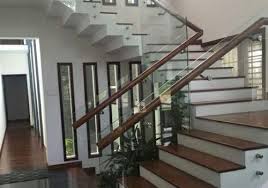 Design of stair railings using rattan wood. Trending Glass Stairs In Kerala Glass Handrail Glass Staircase Staircase Design