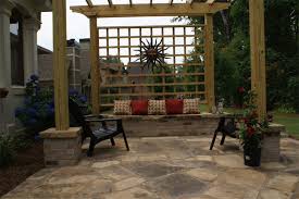 Seating consists of large patio lounge seating. Patio Landscaping Ideas