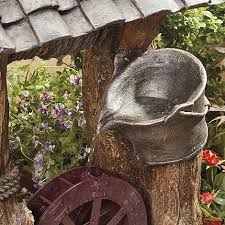 My solution was to purchase a wishing well lawn ornament to hide the pipes. Wishing Well Water Feature Thompson Morgan
