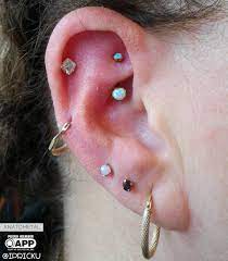 Rook Piercing With A White Opal J Curve Barbell From Anatometalinc Anodized In Studio To Rose Gold We Are S Gold Body Jewellery Body Jewelry Rook Piercing