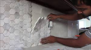 Once you buy your tiles, mark them according to the wall measurements so you can make the proper cuts. How To Install Backsplash In Kitchen 3 Inch Hexagon Mosaic Tile Youtube