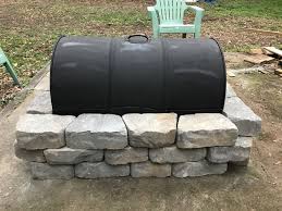 Related with fire pit category. Inexpensive Fire Pit Made From A 55 Gallon Drum A Grate From Northern Tool And Blocks From Lowe S 55 Gallon Drum Fire Pit Camping Fire Pit