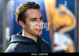 Canisius left wing Alton McDermott, right, and defenseman Tyrell Buckley  during an NCAA college hockey practice in Buffalo, N.Y., Thursday, Jan. 26,  2023. McDermott's grandfather, former NHLer Paul Henderson, scored the  decisive