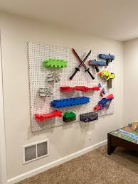 The targets only take minutes to make and give your kids something to shoot at besides each other. The Diy Nerf Gun Storage Wall You Need At Your House Seeing Dandy