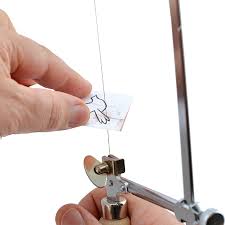Image result for sawing metal with a jewellers sawframe