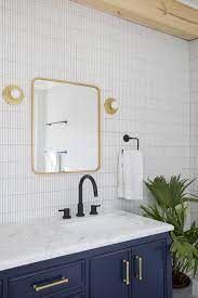 Bathroom with black and gold hardware. Blog Margaret Wright
