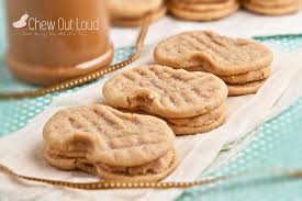 Salted nutter butter and caramel pretzel cookies ~ a chewy peanut butter cookie, rippled with mini nutter butters, stuffed with caramel pieces, studded with pretzels and finished with maldon sea salt. Homemade Nutter Butters Peanut Butter Sandwich Cookies Chew Out Loud