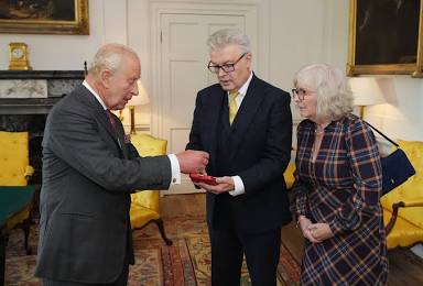 His Majesty presenting the royal honors to Sir James MacMillan, AI generated