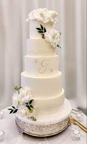 The white chocolate cake is light yet. Smooth Buttercream White Roses Lace Tall Wedding Cake Tall Wedding Cakes Wedding Cakes Cream Wedding Cakes