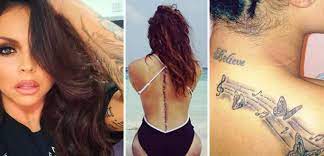 Fans of jesy nelson are rushing to defend the little mix singer after she uploaded images on instagram of her new tattoos, which have since been deleted, showing the letter q on her face and. Little Mix Tattoo Guide Perrie Edwards Jessie Nelson Leigh Anne Pinnock And Jade Thirwall S Ink Revealed