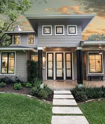 Your exterior paint scheme should highlight the most beautiful features of your home. 43 Eye Catching Home Exterior Designs Photo Gallery Home Awakening Gray House Exterior House Exterior Exterior House Colors