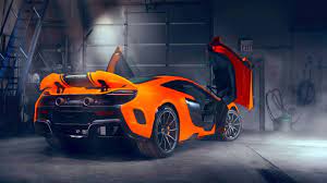 Skachat Oboi Svet Vverh Garazh Dveri Spojler Vid Szadi Maclaren Razdel Superkary V Razreshenii 1366x768 Car Wallpapers Super Cars Sports Car Wallpaper