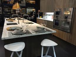 White marble kitchen island with bar stools. 10 Dashing Modern Kitchens That Combine Marble And Wood