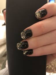Acrylic Black And Gold Glitter Nails Black Polish With Gold Tips That Trickle Down The Nail One Of My Faves Gold Nails Black Gold Nails Gold Tip Nails