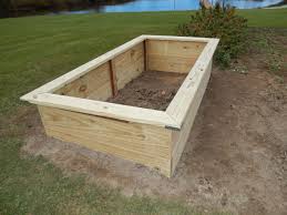 There are endless designs, sizes, and also tons of wood choices. Raised Bed Construction Made With 2 X 12 4 X 8 Treated Lumber Beginning Of My Hugelk Raised Garden Bed Plans Garden Beds Raised Garden Bed Construction