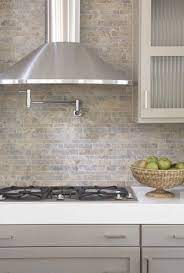 Black stone with grey and white veining in a stacked mosaic tile. Back Splash Natural Stone In Modern Mosaic Taupe Kitchen Stone Backsplash Kitchen Grey Shaker Kitchen
