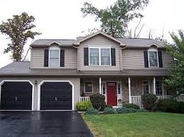 Earthy browns and greens look great with. Beige House With Black Shutters Black Shutters Tan House For The Home Tan House Exterior Paint Colors For House Exterior House Colors