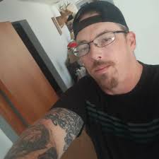 The officer may have been "visually intimidating voters," according to the  county Democratic Party chairman.