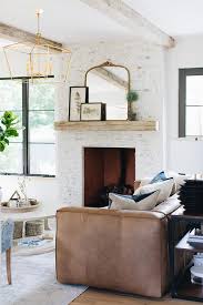 The best thing about grey is that it can be toned way down or simply serve as a good base for a lot of color. Brown Leather Sofa On Gray Faded Rug Transitional Living Room