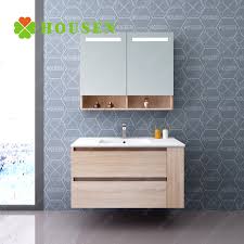 The addition of the small medicine cabinet overhead adds even more storage space and a small mirror. China Corner Vanity For Bathroom Led Mirror Cabinet White Solid Wood Bathroom Vanity Photos Pictures Made In China Com