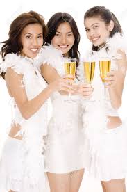 Three Attractive Asian Women In White Drinking Champagne Stock ...