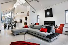 Vibrant Red Nuances Breaking The Monotony The Chatsworth House By Cambuild Freshome Com Grey And Red Living Room Living Room Grey Living Room Red