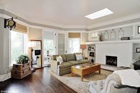 Light Floods The Living Room Through Huge Bay Windows And A Skylight At This Top Floor 2 Bedroom Apar Vintage Apartment Decor Brick Fireplace Vintage Apartment