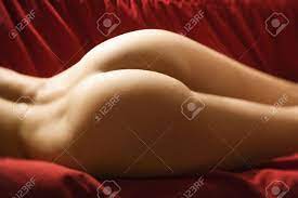 Derriere Of Sexy Nude Caucasian Young Adult Female Lying Seductively On Red  Couch. Stock Photo, Picture And Royalty Free Image. Image 2174240.