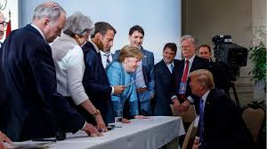 If necessary… while president trump threatened to leave the summit early and called for russia (expelled in 2014 for invading. Trump At G7 Who S Who In Merkel S Photo Bbc News