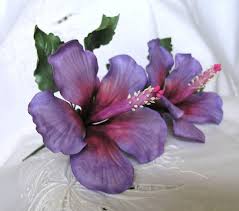 Including more than one variety of flowers gives the cake a gorgeous contrast of colors, making it an exquisite treat for the eyes as well. Purple Magic Hibiscus Gum Paste Flowers Hand Painted Edible Cake Topper And Cupcake Decorations Fondan
