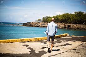 Mid Adult Man Walking On Pier By Water Image Stock By Pixlr