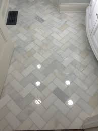 We love using herringbone in our projects because it adds so much character and creates some varied texture. Pin By Gemma Zanowski On Home Decor Herringbone Marble Marble Bathroom Floor Bathroom Flooring