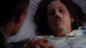 Scully: "It's true, John. She's gone." John Doggett: "I don't accept that.  Look at her breathing. Her heart's still beating. There's got to be hope."  Scully: "There's no measurable electrical activity in