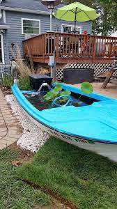 Floating candles and plastic or artificial pond plants and water lilies, small fountains and decorative animals Converting A Boat To Fish Pond Page 2 Garden Pond Forums Ponds Backyard Fish Pond Goldfish Pond