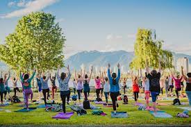 Performing yoga asanas with the aid of ropes. Free Outdoor Yoga This Summer At Kits Beach Until August 30th Kitsilano Ca
