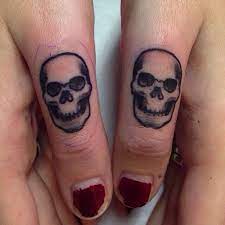 Pin By Colette Artieda On Tattoos Tattoos Finger Tattoos Skull Finger Tattoos