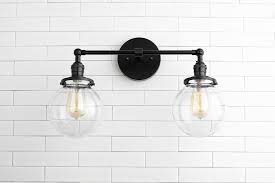 What kind of light fixtures are in bathrooms? Vanity Model No 5657 Peared Creation