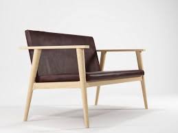 The provided wooden sofa is acclaimed for its impeccable design in the market. Vintage Small Sofa By Karpenter Design Hugues Revuelta