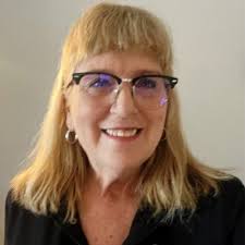 Today IM owners Claire & Kevin Weslaski presented a check to The Racine  Family YMCA for $5,000 to sponsor the 2018 10-Mile Lighthouse Run to be  held