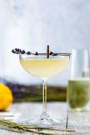 The Addition Of Lavender Simple Syrup Puts A Unique Spin On The Classic French 75 Cocktail This Prosecco French 75 Cocktail Gin Cocktails Mixed Drinks Recipes